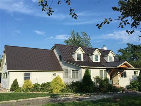 white house with bronze metal roof|metal roof and siding combinations.